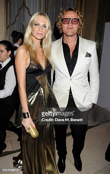 Poppy Delevingne and Emilio Pucci creative director Peter Dundas attend the Harper's Bazaar Women Of The Year Awards in association with Estee Lauder...