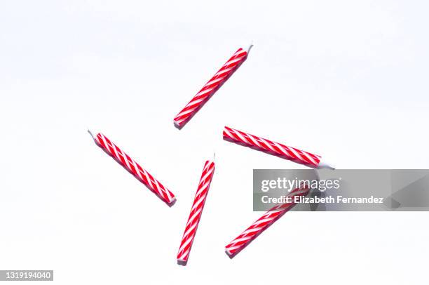 red and white birthday candles on the white background; flat lay - candle white background imagens e fotografias de stock