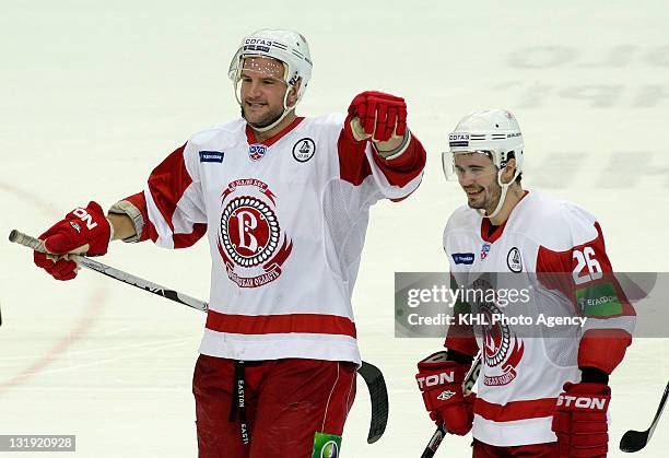 Christopher Brennan and Sergei Lesnukhin of the Vityaz celebrate the goal during the game between Vityaz Chekhov and CSKA Moscow during the KHL...