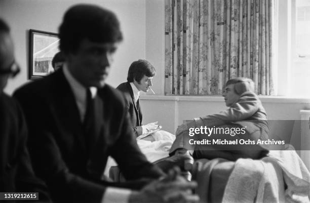 British musician Dave Clark with bandmate British musician Lenny Davidson, both of The Dave Clark Five, in their room at Delmonico's Hotel on Park...