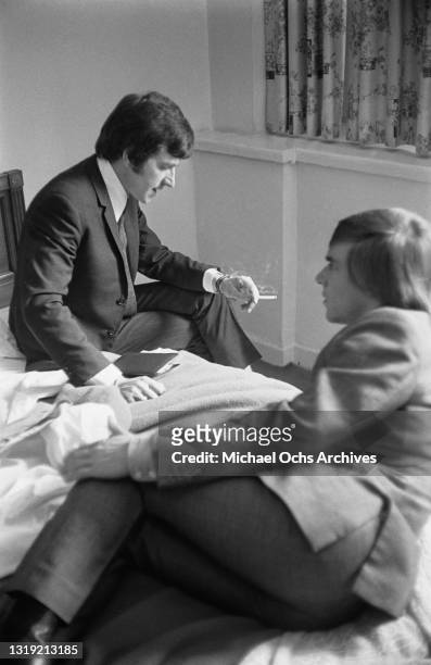 British musician Dave Clark with bandmate British musician Lenny Davidson, both of The Dave Clark Five, in their room at Delmonico's Hotel on Park...