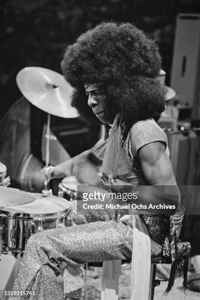 American singer-songwriter and musician Sly Stone plays the drums as his band play Madison Square Garden in the Manhattan borough of New York City,...