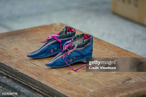 shoes feet shoes apparel clothing folk arts and crafts handmade products articles for daily use cloth shoes for women's shoes foot-binding folk folk culture national costume - foot binding stock pictures, royalty-free photos & images