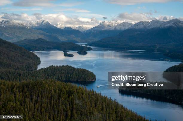 a boat on clayoquot sound - inlet stock pictures, royalty-free photos & images