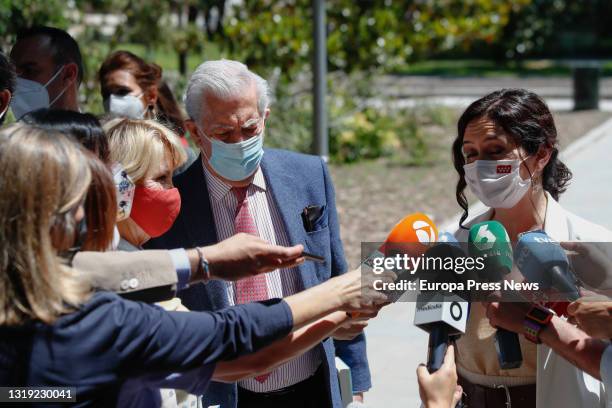 The acting president of the Community of Madrid, Isabel Diaz Ayuso , accompanied by the writer Mario Vargas Llosa , addresses the media before the...