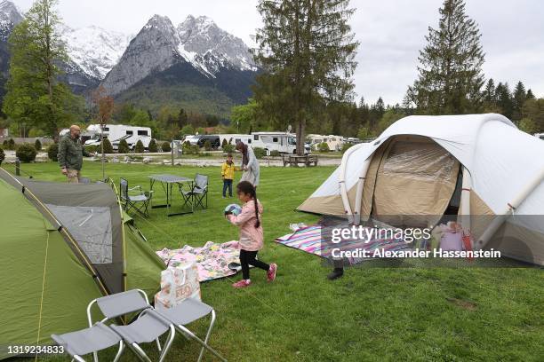 People enjoy the atmosphere at campsite "Camping Erlebnis Zuspitze Grainau" in front of Germany's highest peak "Zugspitze" on the first day of the...