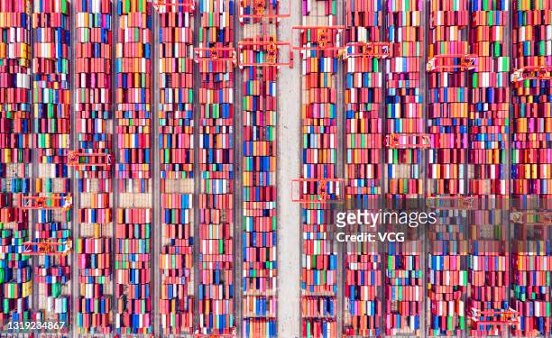 Aerial view of shipping containers sitting stacked at Yangshan Deepwater Port, the world's biggest automated container terminal, on May 21, 2021 in...