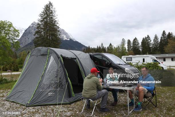 People enjoy the atmosphere at campsite "Camping Erlebnis Zuspitze Grainau" in front of Germany's highest peak "Zugspitze" on the first day of the...