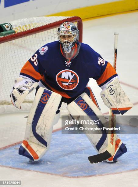Rick DiPietro of the New York Islanders tends goal during the third period against the Winnipeg Jets at Nassau Coliseum on November 3, 2011 in...