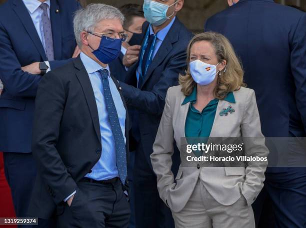 Italian Finance Minister Daniele Franco and Spain's Minister of Economy Nadia Calviño wear protective masks as they arrive to participate in the...