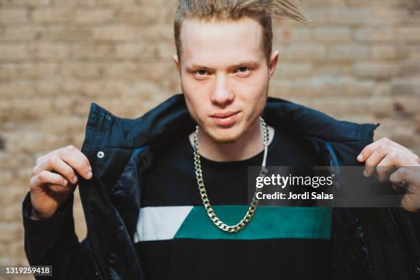 portrait of young man on the street - white rapper stock pictures, royalty-free photos & images