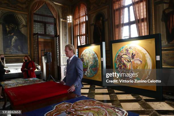 Leon Löwentraut attends the exhibition opening "Leonismo" by artist Leon Loewentraut on May 21, 2021 in Venice, Italy. In the library, directly on...