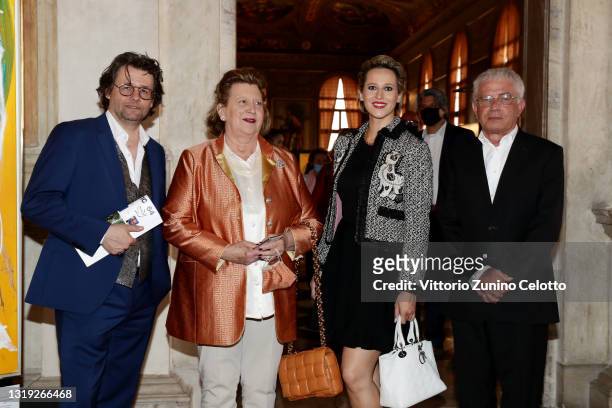 Dirk Geuer, a guest and Eva-Maria Blank and Manfred Möller attend the exhibition opening "Leonismo" by artist Leon Loewentraut on May 21, 2021 in...