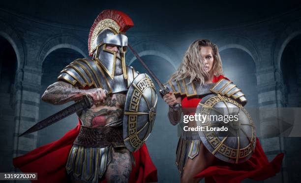 two muscled warrior gladiators holding weapons - ancient female warriors stock pictures, royalty-free photos & images