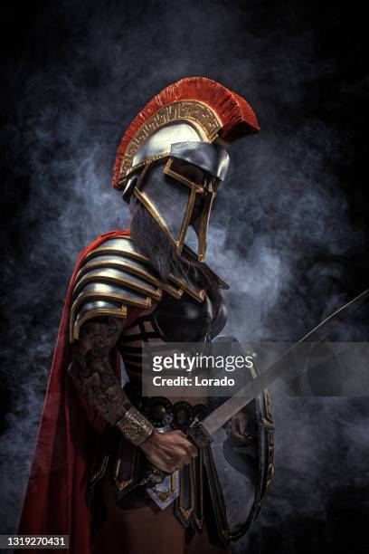 a senior female warrior gladiator holding a weapon - ancient female warriors stock pictures, royalty-free photos & images