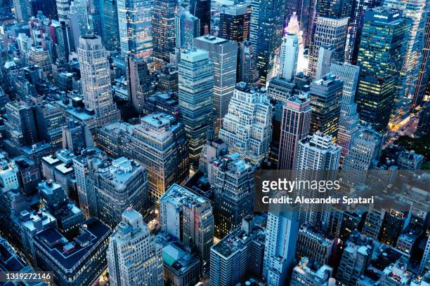 new york skyscrapers at night, aerial view, usa - wall street stock-fotos und bilder