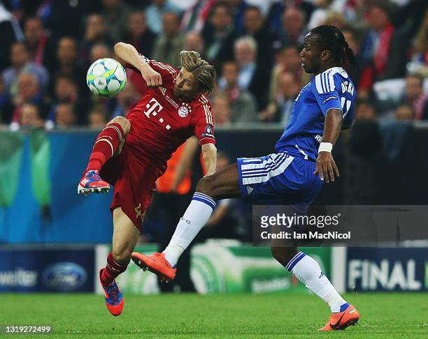 Didier Drogba of Chelsea vies with Anatoliy Tymoshchuk of Bayern Muenchen during UEFA Champions League Final between FC Bayern Muenchen and Chelsea...