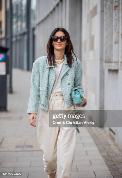 Golestaneh Mayer-Uellner is seen wearing white shirt, beige paperbag pants Isabel Marant, dad sandals Marni, turquoise bag Chanel, necklace Tiffany,...