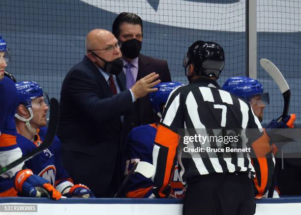 Head coach Barry Trotz of the New York Islanders works the game against the Pittsburgh Penguins in Game Three of the First Round of the 2021 Stanley...