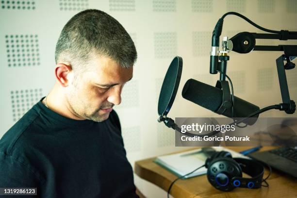 handsome male radio host in studio - radio host stock pictures, royalty-free photos & images