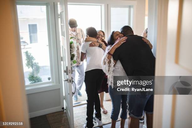 extended family reuniting together for gathering - family smiling at front door stock pictures, royalty-free photos & images