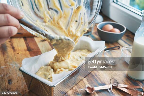 preparing banana bread in domestic kitchen - banana loaf stock pictures, royalty-free photos & images