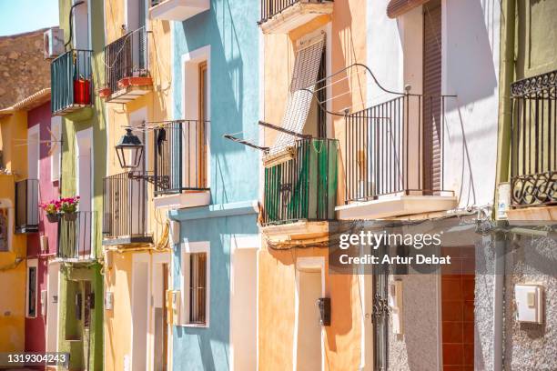 colorful houses in old town of spain with sunny and vivid colors. las casas de colores en villajoyosa en un dia de verano en alicante. - alicante street stock pictures, royalty-free photos & images