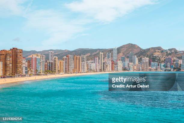 benidorm skyline in costa blanca of spain with blue sea. - benidorm stock pictures, royalty-free photos & images