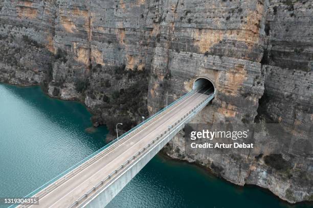 aerial view of stunning elevated road with tunnel in the mountains of spain. - 斜めから見た図 ストックフォトと画像