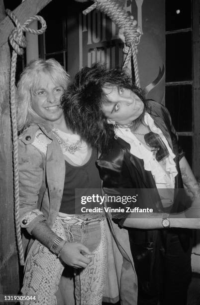 American singer Vince Neil and American bass player Nikki Sixx of American glam metal band Motley Crue attend the 'Motley Crue in Concert: Theatre of...