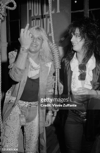American singer Vince Neil and American bass player Nikki Sixx of American glam metal band Motley Crue attend the 'Motley Crue in Concert: Theatre of...