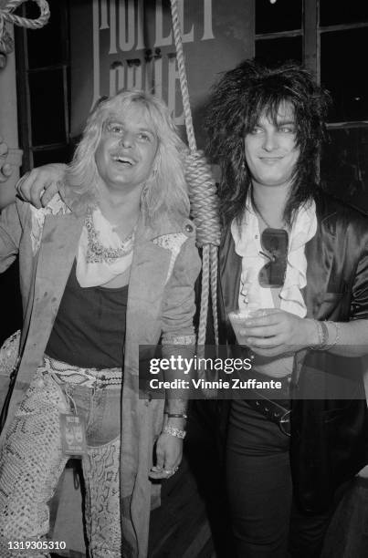 American singer Vince Neil and American bass player Nikki Sixx of American glam metal band Motley Crue attend the 'Motley Crue in Concert: Theatre of...