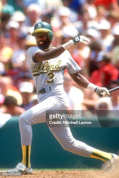 Alfredo Griffin of the Oakland Athletics takes a swing during a baseball game against the Boston Red Sox on July 8, 1987 at Fenway Park in Boston,...