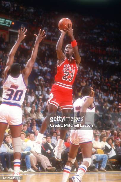Michael Jordan of the Chicago Bulls takes a jump shot during a NBA basketball game against the Washington Bullets at the Capital Centre on December...