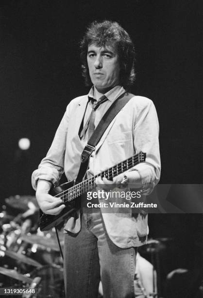 British musician and songwriter Bill Wyman, playing a Steinberger custom short-scale XL bass, at the Ronnie Lane ARMS Benefit Concert at Madison...