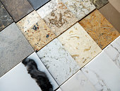A sample of decorative artificial stone. Natural stone texture for kitchen countertops and floors. Finishing materials
