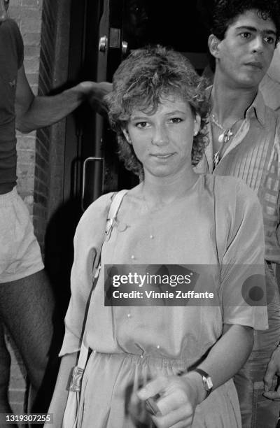 American actress and comedian Kristy McNichol with hairdresser Joey Corsaro behind McNichol, to the right of the image, location unspecified, circa...