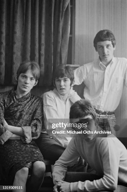 British rock band Small Faces in a group portrait, with Marriott, Jones and Lane all seated with Jones standing, location unspecified, circa 1967.