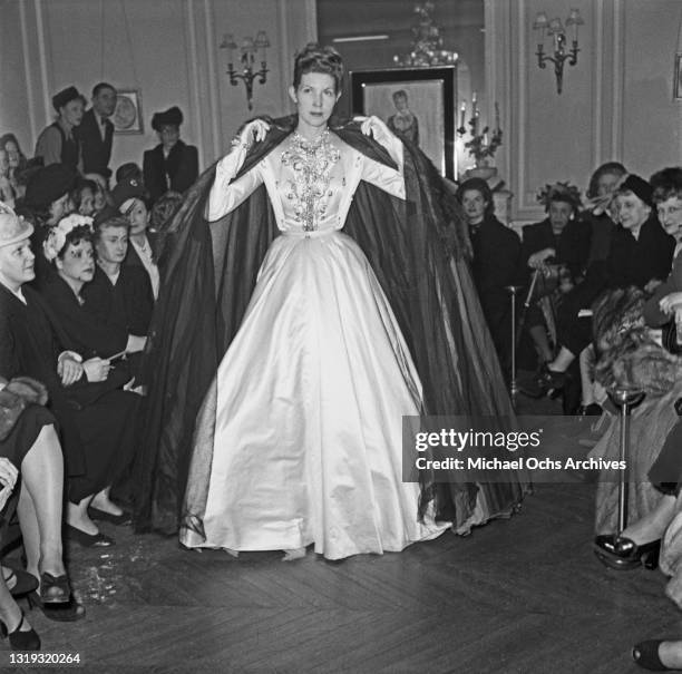 An unspecified model wearing a Jacques Fath design at the designer's Summer 1948 fashion show in Paris, France, February 1948.