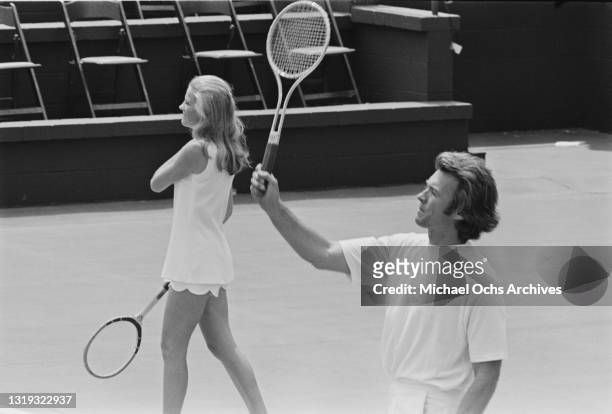 Maggie Johnson and her husband, American actor and film director Clint Eastwood, playing in the annual celebrity tennis tournament, held at the La...