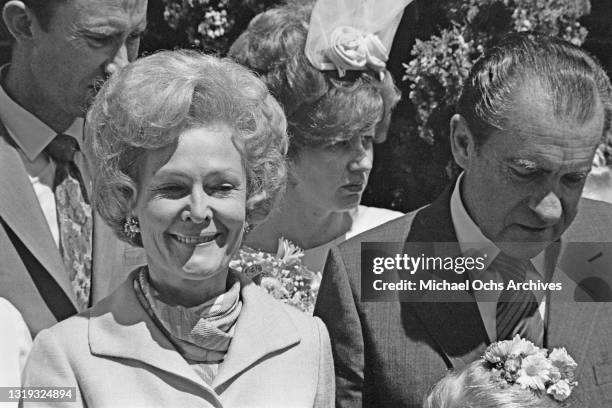 American First Lady Pat Nixon and her husband, American politician Richard Nixon , United States president, attend a wedding at St Andrew's...