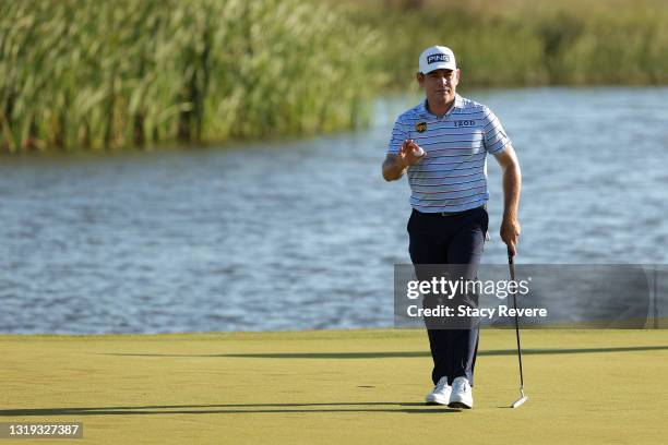 Louis Oosthuizen of South Africa waves to the gallery from the 17th green during the second round of the 2021 PGA Championship at Kiawah Island...