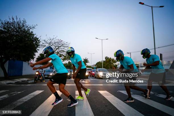 Brazilian bobsledders Gustavo Ferreira, Jefferson Sabino, Edson Martins and Rafael Souza cross the street on May 20, 2021 in Sao Caetano do Sul,...