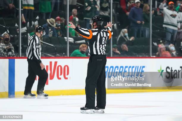 Referee Dave Jackson signals "No Goal" after Peter DeBoer of the Vegas Golden Knights challenged a goal by Joel Eriksson Ek of the Minnesota Wild for...