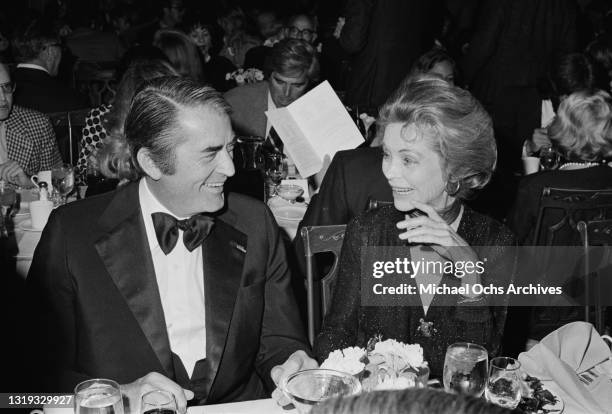 American actor Gregory Peck and an unspecified woman attend a celebration remembering film producer David O Selznick, at an unspecified venue on the...