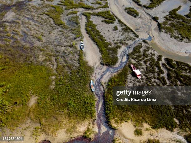 aerial view of boats in mangrove area during low tide, amazon region, brazil - brazil aerial stock pictures, royalty-free photos & images