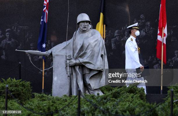 Military official walks through the Korean War Veterans Memorial prior to a groundbreaking ceremony with President Moon Jae-in of the Republic of...