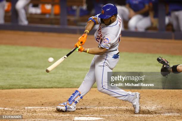 Khalil Lee of the New York Mets hits a go-ahead RBI double against the Miami Marlins during the twelfth inning at loanDepot park on May 21, 2021 in...
