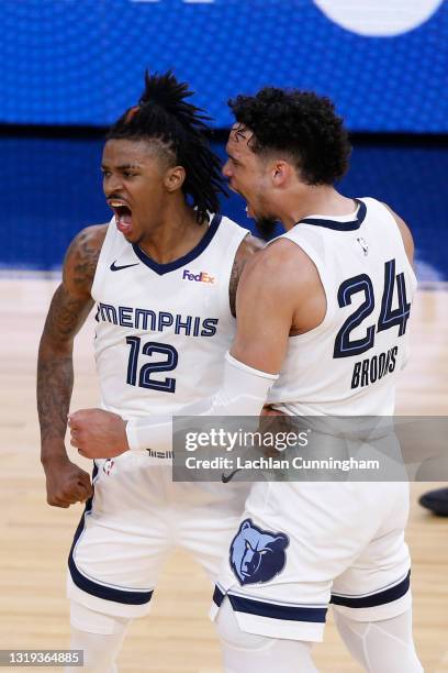 Ja Morant and Dillon Brooks of the Memphis Grizzlies celebrate late in overtime of the NBA Play-In Tournament game against the Golden State Warriors...