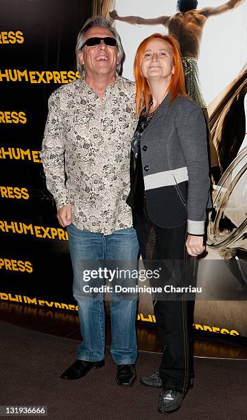 Singer Gilbert Montagne and wife attend the'Rhum Express' Paris Premiere at Cinema Gaumont Marignan on November 8, 2011 in Paris, France.